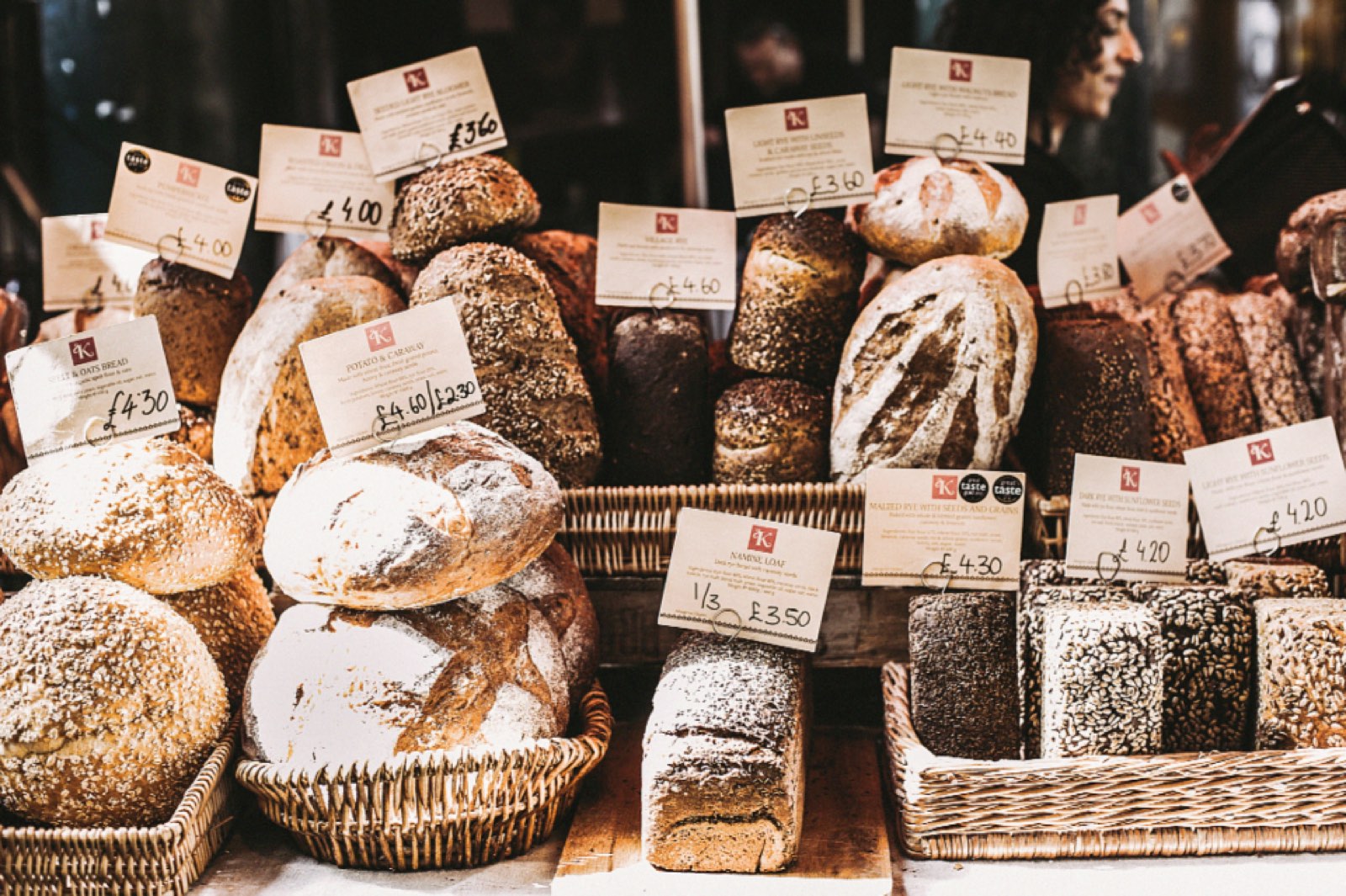 Baskets of fresh bread with handwritten price tags