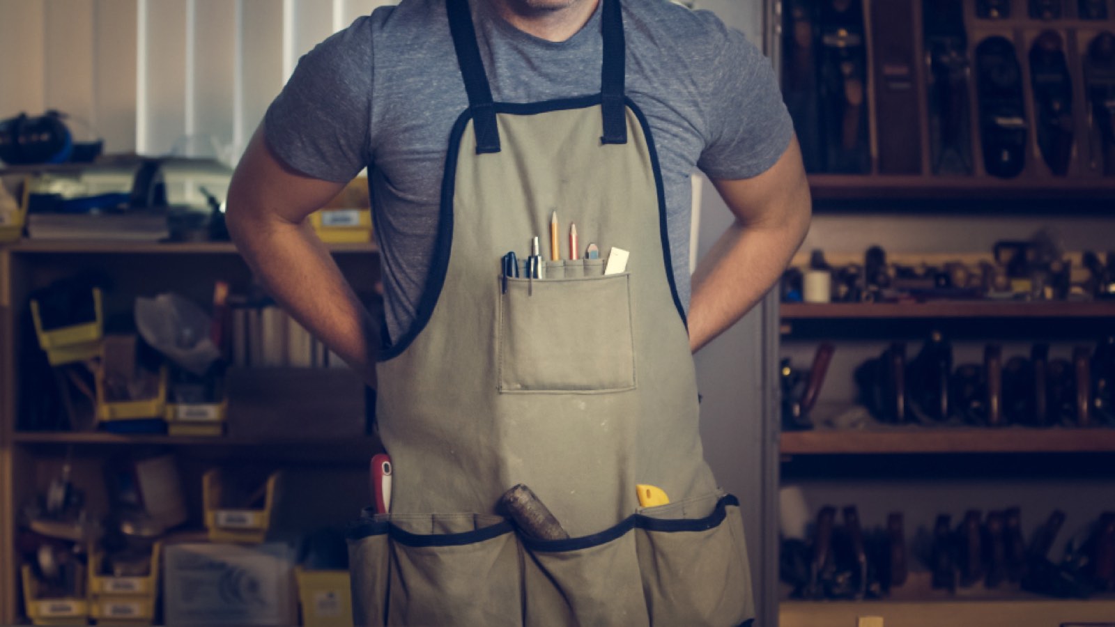 A craftsman in his workshop apron