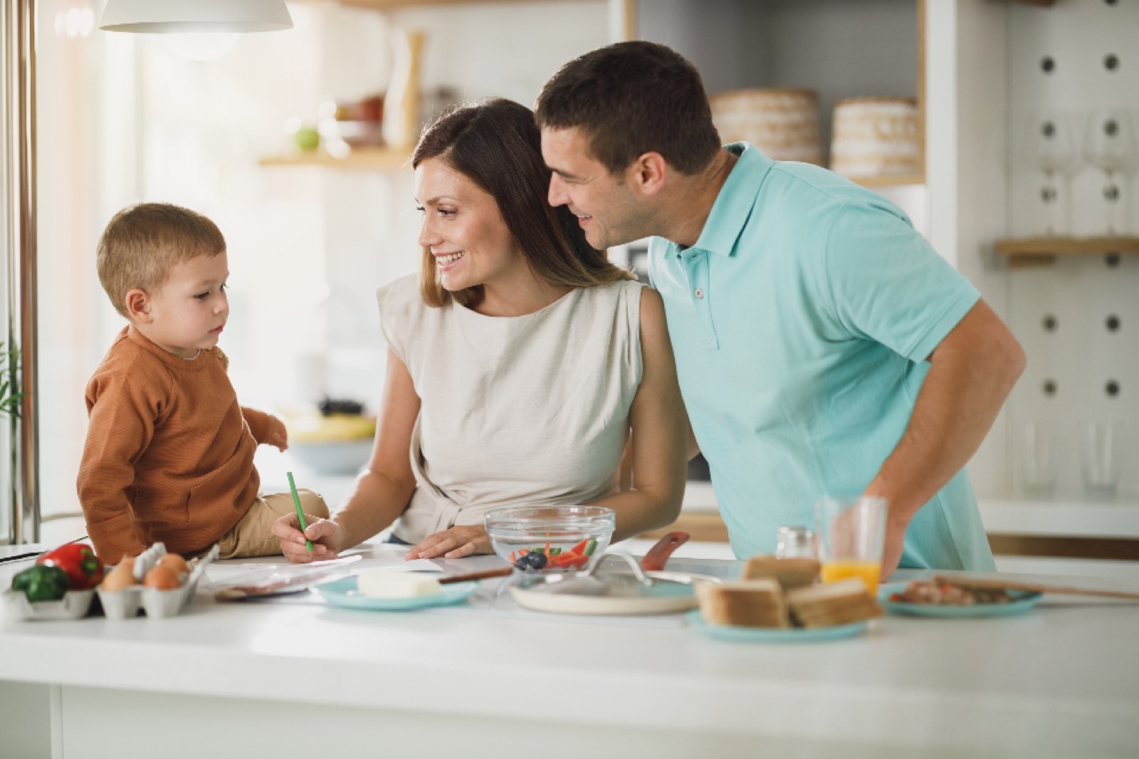 A family cooking together in the kitchen