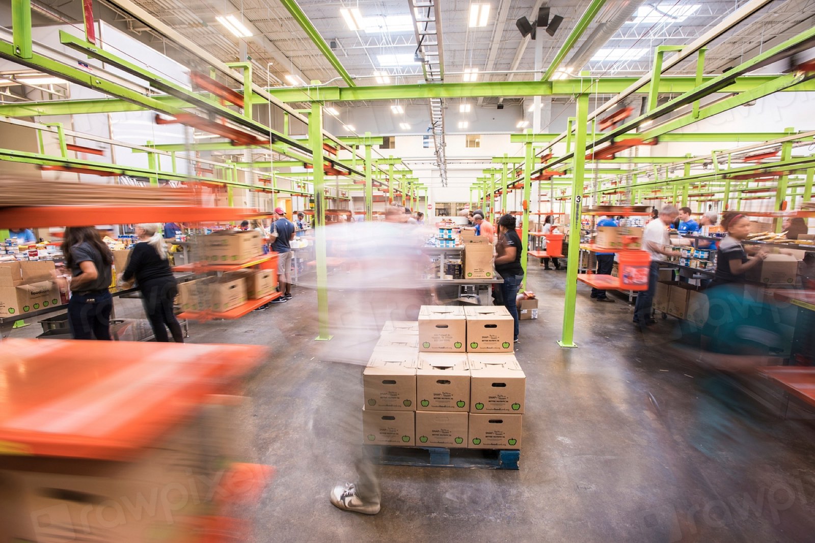 A busy warehouse floor with packed goods